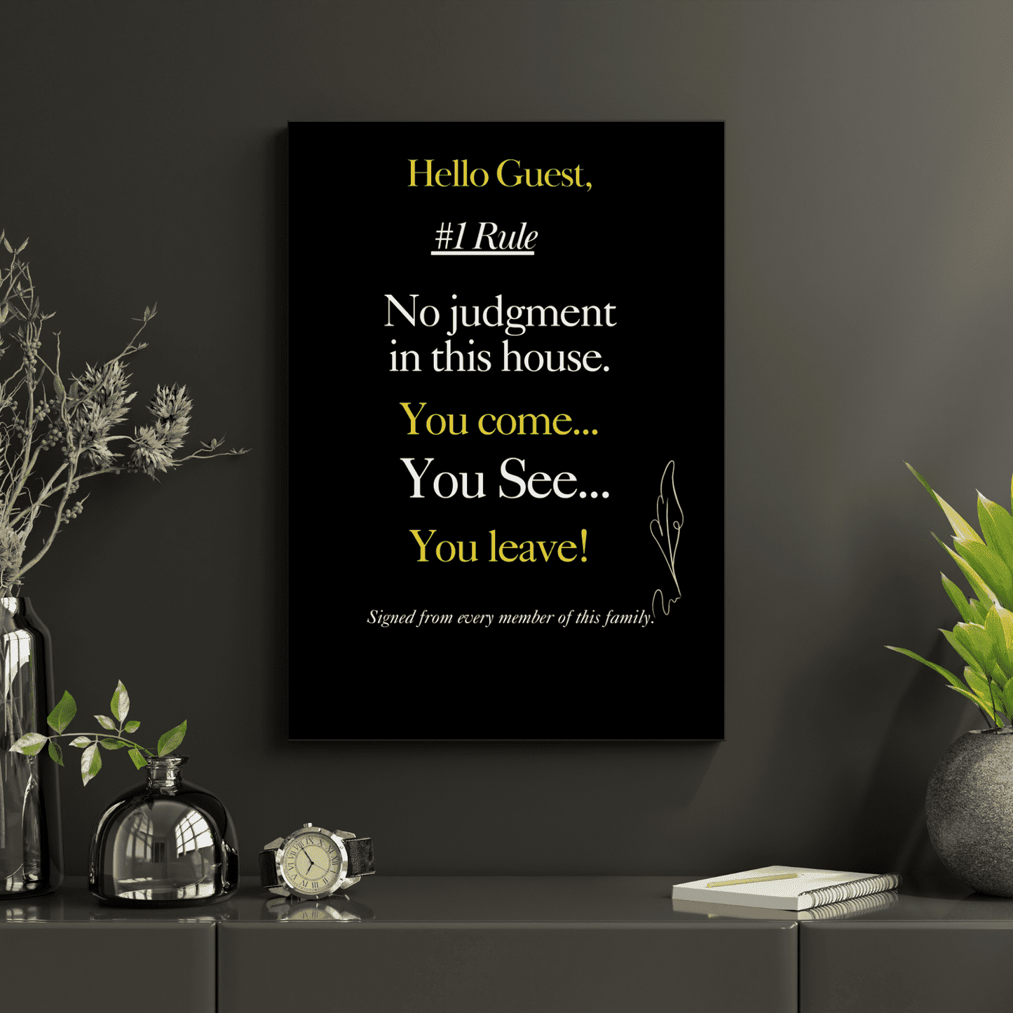 Decorative house rule wall art with a humorous quote on a dark wall with plants and decor.