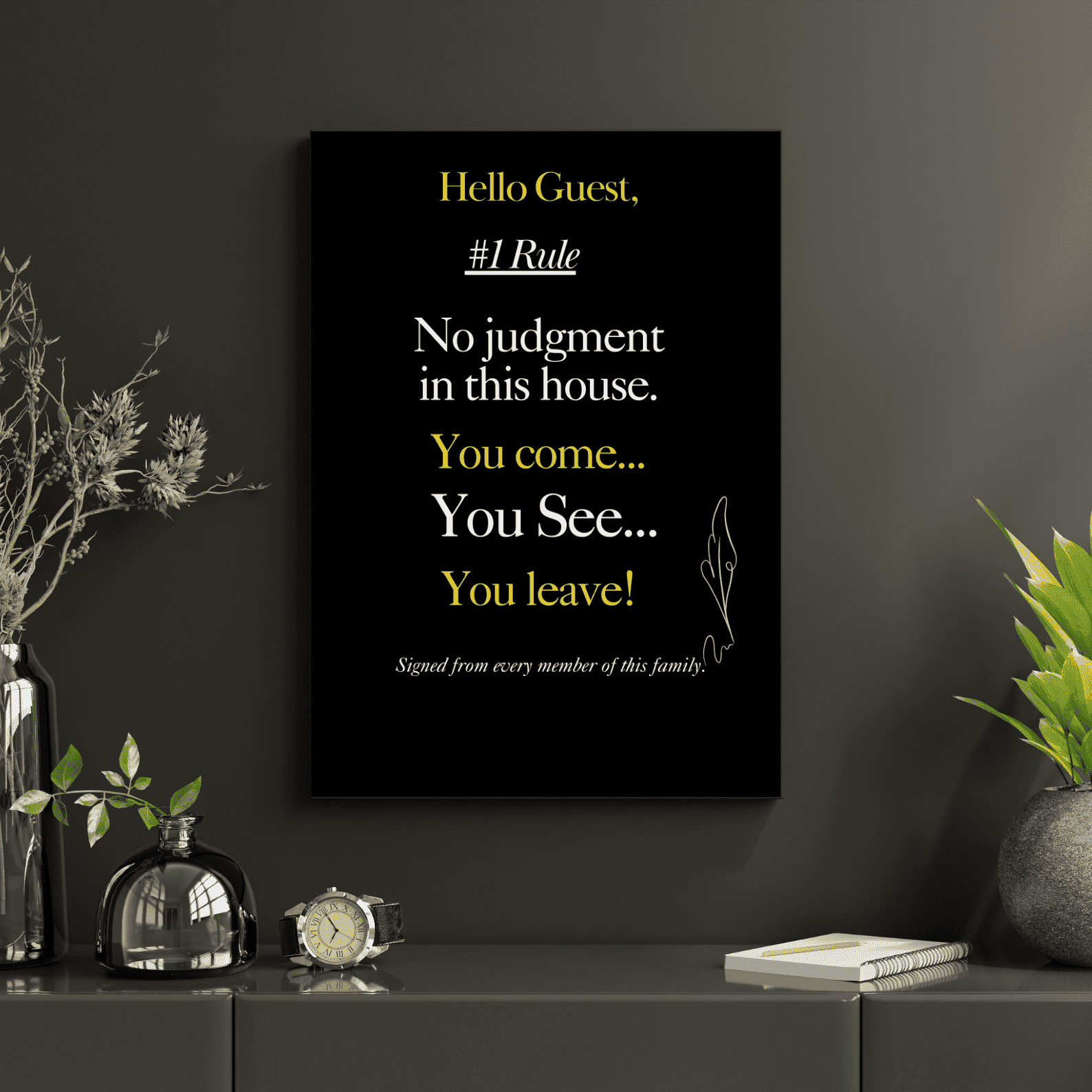 Decorative house rule wall art with a humorous quote on a dark wall with plants and decor.