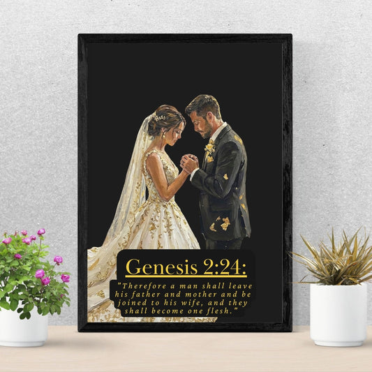 Framed artwork of a bride and groom with 'Genesis 2:24' text on a black background, placed on a wooden surface with plants.