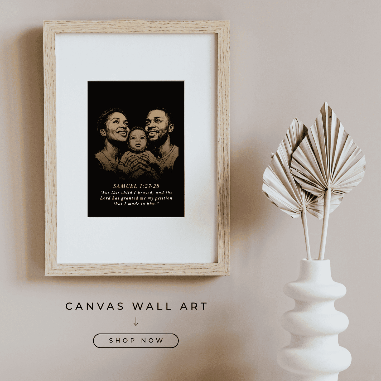 Framed canvas  baby nursey wall art with a family portrait and text on a beige wall, next to a white vase with dried leaves.