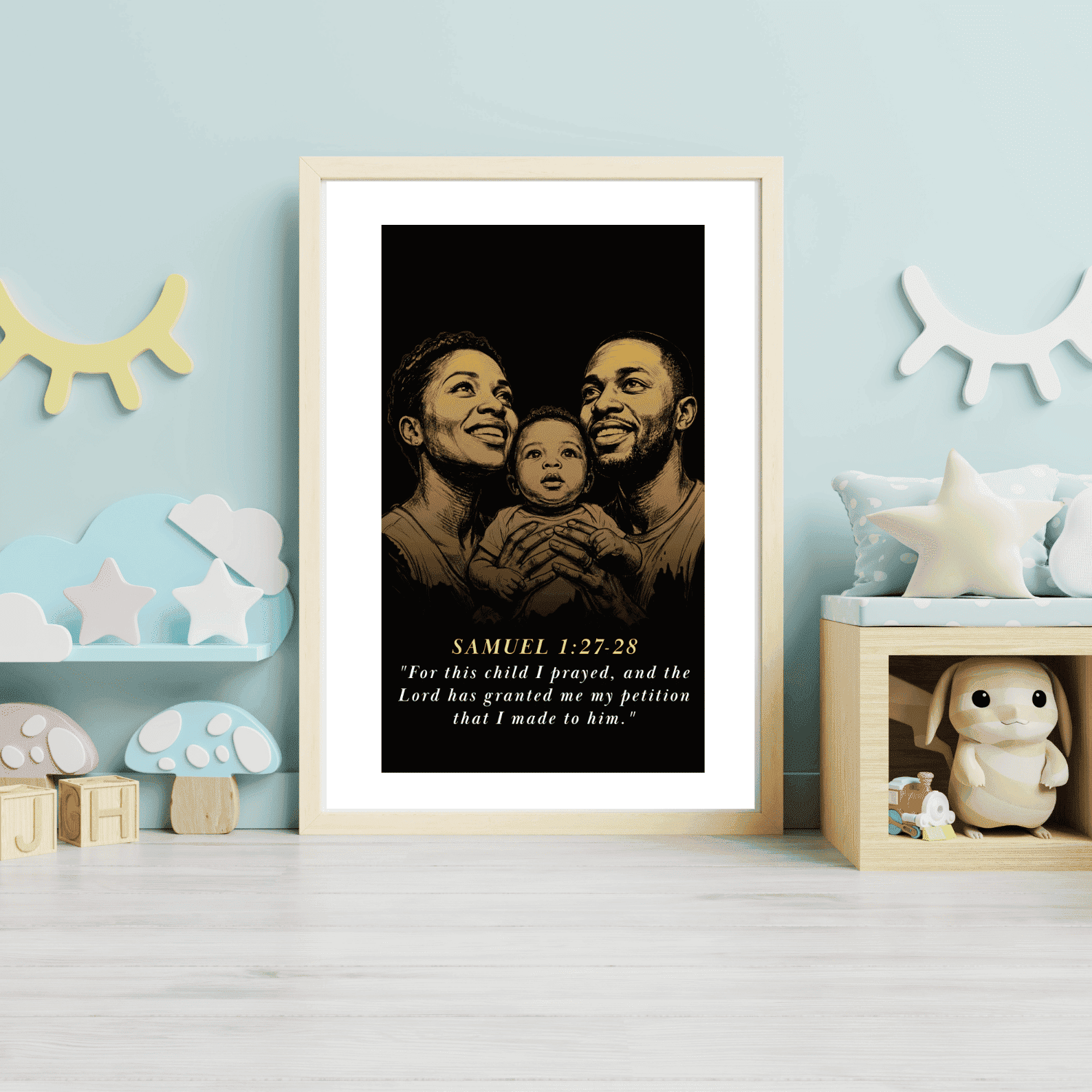 christian baby Framed artwork of a family with a child on a light blue wall with decorative items.